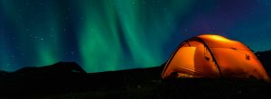 Illuminated Tent and northern lights.