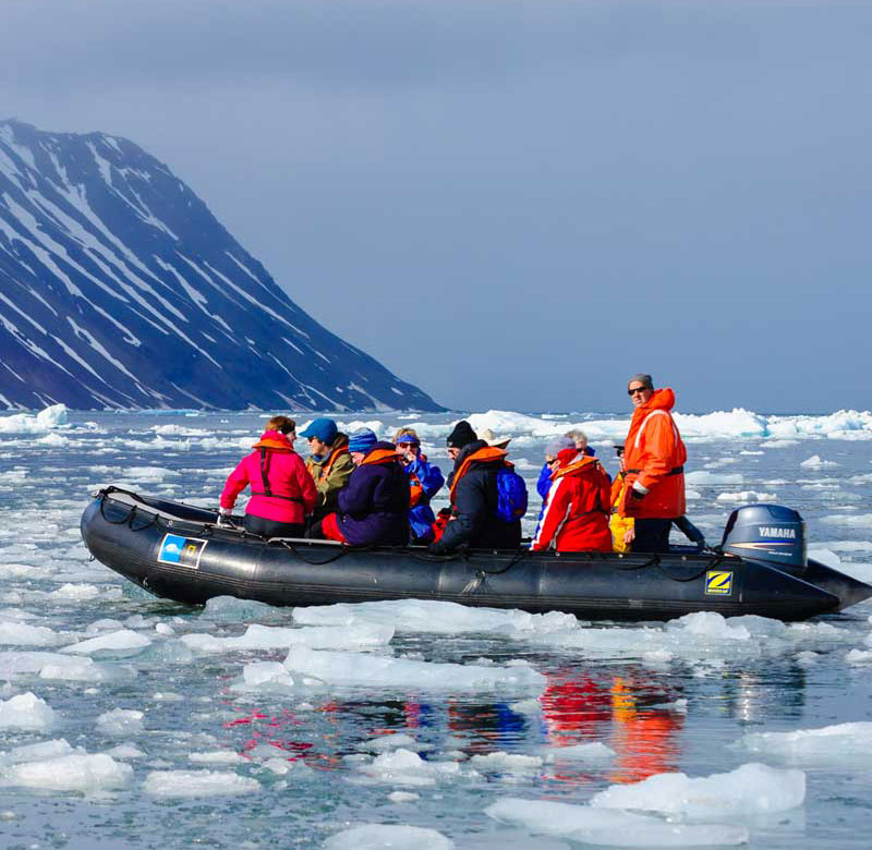 Arctic tourists in dinghy