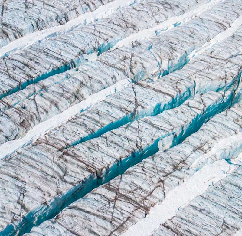 Aerial view of cracks in glacier ice