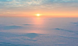 Glacial field with low winter sun