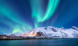 Aurora Borealis and icy peaks