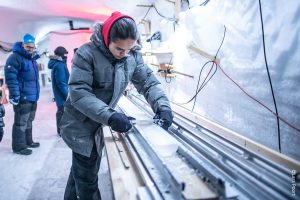 A Greenlandic High School student at EastGrip taking initial measurements of a 12000 year old ice core